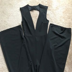 Black pant jumper with v-cut front, open in back